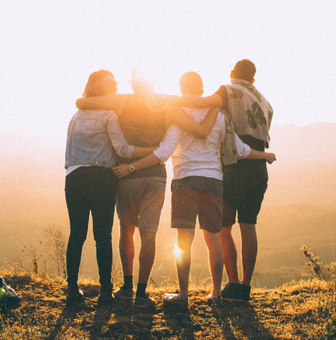 friends looking at sunset